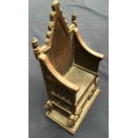 A throne cast iron money box, made by Harper