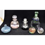 A collection of paperweights, including Caithness glass perfume jars, etc Condition: Damage to