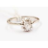A diamond 18ct gold solitaire ring, the diamond weighing approx. 0.15ct claw set with a floral