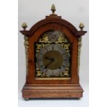 An early 20th Century oak bracket clock, with brass and silvered face, eight day movement, Roman