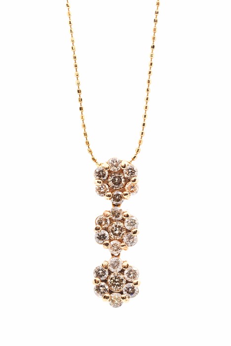 A champagne diamond and 9ct rose gold cluster necklace, comprising three hinged floral details