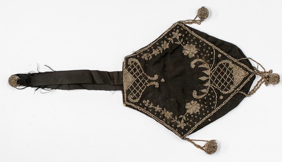 A Victorian evening purse with cut steel beaded decoration