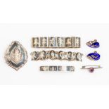 A collection of assorted Siamese niello silver jewellery including a two bracelets, a brooches and a