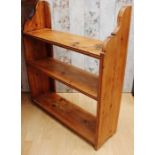 A Victorian pine three sectioned bookshelf, 91cm high, 79cm wide, 24cm deep, together with an