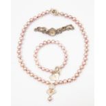 A pink cultured pearl bracelet and necklace en suite, with white metal clasps, the necklace