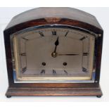 A late 19th Century mahogany cased German mantle clock, painted dial with Roman numerals, brass