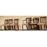 A George III part set of five mahogany chairs, comprising four side chairs, a matching carver chair,