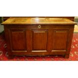 An 18th Century joined oak chest, circa 1720, having raised and fielded panels to front, panelled