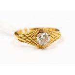 A diamond and 18ct gold solitaire ring, the claw set diamond approx. measuring approx. 0.50ct,