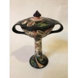 A Moorcroft Macintyre Florian style pedestal bon-bon dish with back stamp to underside, boxed.
