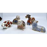 Five Royal Crown Derby paperweights in the form of a Chinese Dragon, spaniel, bull dog, ram and a