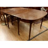 A George III mahogany D-end extending tea table with one leaf, circa 1810, raised on turn tapered