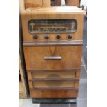 A mid 20th Century walnut cased radiogram, 90cm high, 47cm wide, 43cm deep