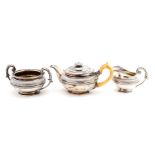A matched George IV silver tea set including teapot, sugar bowl and milk jug, the sugar bowl London