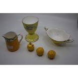 A group of Royal Worcester, all yellow ground including: set of three condiments (salts & a pepper