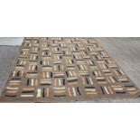 A 1960's design carpet, abstract decoration on a chocolate brown ground, 366cm x 300cm