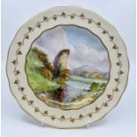A Royal Crown Derby hand painted cabinet plate, by WEJ Dean, depicting Ilam Rock in Dovedale, gilded