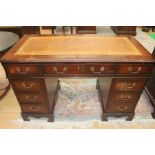A traditional mahogany twin pedestal desk, of recent manufacture, the top with inset leather