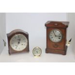 A German Maritime eight day mantle clock, an early 20th Century oak eight day mantle clock, plus a