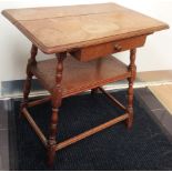An early 20th Century oak occasional table, of two tier form, fitted with a single drawer, 72cm