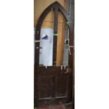 A Victorian Gothic pine door, 248cm high, 89.5cm wide, 4cm thick