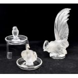 A collection of Lalique glass items including pin dishes, small vase, paperweight, two ashtrays