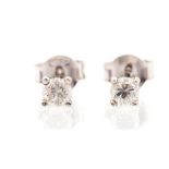 A pair of diamond and 18ct white gold studs, the claw set round brilliant cut diamonds weighing a
