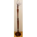 An early 20th Century oak standard lamp, the column with the upper half turned and the lower section