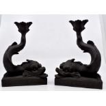 A pair of Wedgwood slate grey Jasper ware dolphin candlesticks CR; slight crack in left hand (