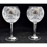 A pair of Waterford Crystal wine glasses, along with a cut glass fruit bowl