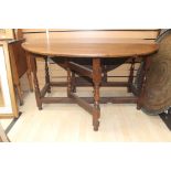 A Victorian joined oak gateleg table, incorporating earlier elements, fitted with a single drawer to