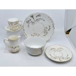 A late Victorian hand gilded tea service, comprising two cake plates, five coffee cups, six coffee