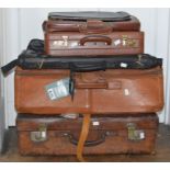 A large leather suitcase 1950s in Tan, well travelled with zip fasting. A large leather fold up suit