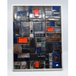 A framed and mounted montage of 12 studio pottery tiles, individually designed, painted and