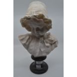 A late 19th Century alabaster bust of a young Victorian girl on marble stand