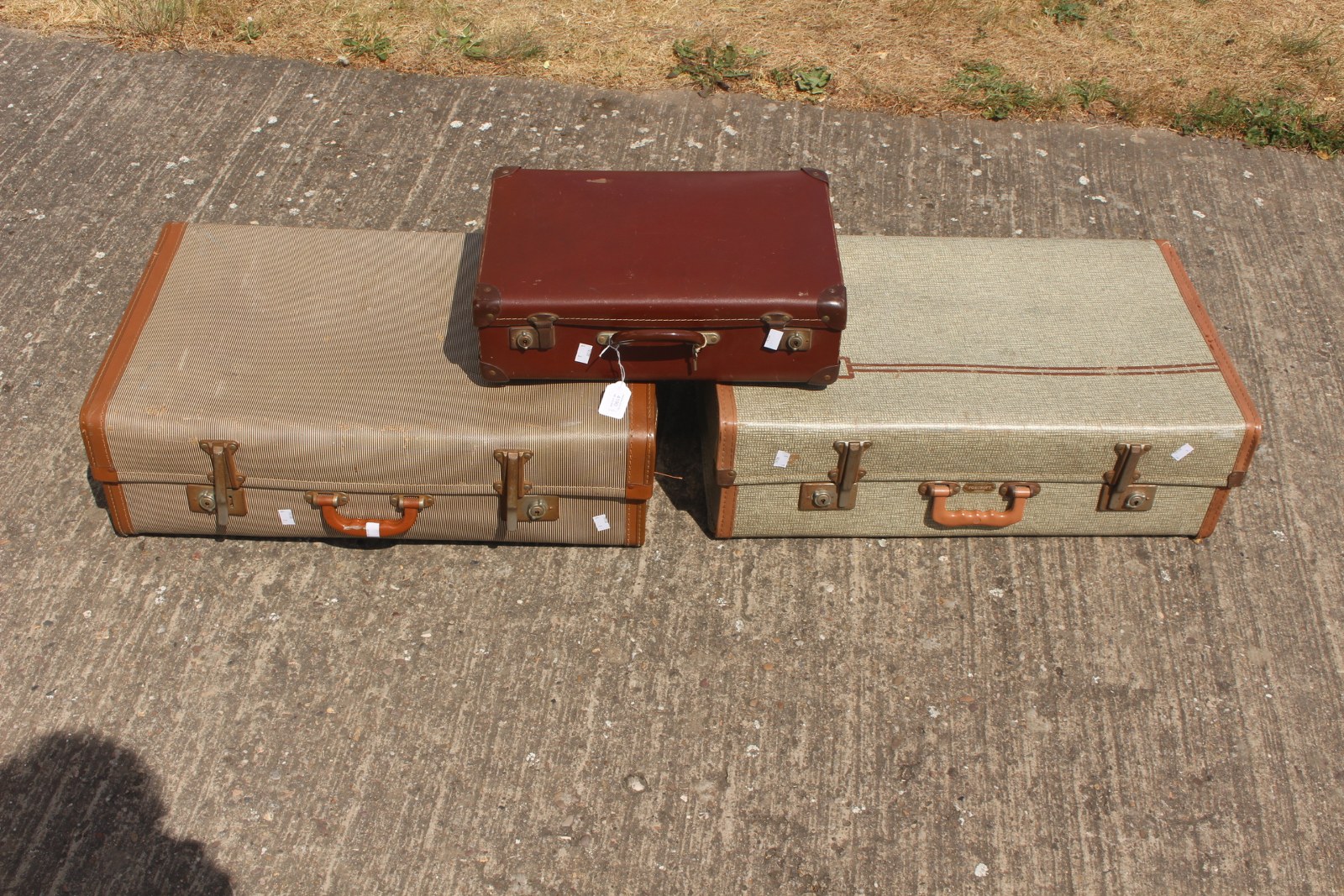 Three mid 20th Century suitcases