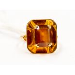 A citrine and gold cocktail ring, set with a step-cut citrine, size N1/2, total gross weight