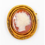 A Victorian carved agate cameo brooch in unmarked yellow metal, possibly 14ct gold, double beaded