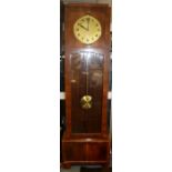 An early 20th Century walnut eight day longcase clock, striking on gongs, gold coloured dial,