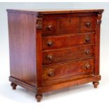 A Victorian mahogany miniature or apprentice wellington chest, four long drawers with turned handles
