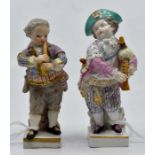 A pair of late Meissen figures of musicians, in 18th Century dress, impressed marks, square bases,
