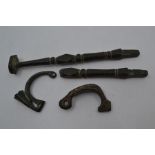 Roman Interest; Two Roman bronze cloak clasps with carved detailing and two Roman bronze furniture