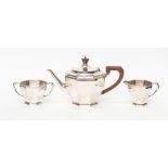 An Art Deco plain octagonal silver three-piece tea set, comprising teapot, milk jug and sugar