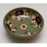A Moorcroft Persian pattern pedestal bowl, circa 1918, celadon ground, W. Moorcroft green signature,