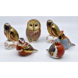 A collection of six Royal Crown Derby paperweights to include two Kingfishers, owl, robin, finch and