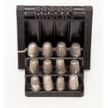 A collection of twelve silver thimbles mainly Charles Horner Dorcas pattern no 6 & 7 together with