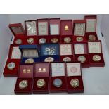 A collection of Halycon Days boxed pill boxes, enamelled with various commemorative patterns (Q)
