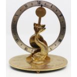 A Dent brass mantle clock, Rd 969702, having a round face, central pendulum, Dolphin brackets,