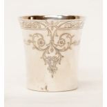 An Elizabeth II silver beaker, flared rim the body engraved with scrolling floral geometric