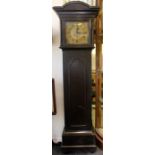 A 20th Century ebonised eight day longcase clock, having a brass dial, three winder holes, the